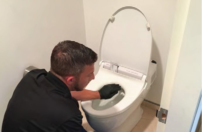 After-sales maintenance work on a toilet.